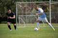 Football players playing soccer in the ground Royalty Free Stock Photo