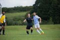 Football players playing soccer in the ground Royalty Free Stock Photo