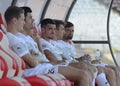Football players on substitution bench