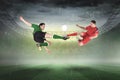 Football players tackling for the ball Royalty Free Stock Photo