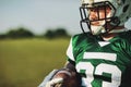 Football quarterback holding a ball during a team practice Royalty Free Stock Photo