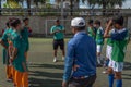 The football referee informs team players about the rules of the game