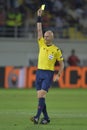 Football referee, Sergei Karasev shows yellow card