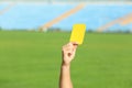Football referee showing yellow card at stadium Royalty Free Stock Photo