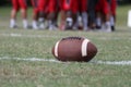 High School American Football Team in Strategy Huddle Pre-Game Royalty Free Stock Photo