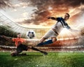 Football scene with competing football players at the stadium Royalty Free Stock Photo
