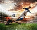 Football scene with competing football players at the stadium Royalty Free Stock Photo