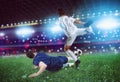 Football scene with competing football players at the stadium Royalty Free Stock Photo