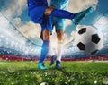 Football scene with competing soccer players at the stadium Royalty Free Stock Photo