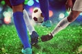 Football scene with competing soccer players at the stadium Royalty Free Stock Photo