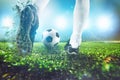 Football scene at night match with close up of a soccer shoe hitting the ball Royalty Free Stock Photo