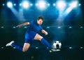 Soccer striker hits the ball with an acrobatic kick in the air at the stadium Royalty Free Stock Photo