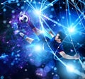Football scene with soccer player in front of a futuristic digital background