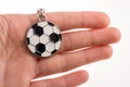Football shaped keyholder in hand