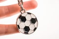 Football shaped keyholder in hand