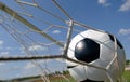 Football - Soccer ball in Goal Royalty Free Stock Photo