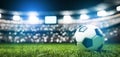 Football soccer ball on grass field on stadium Royalty Free Stock Photo