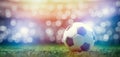 Football soccer ball on grass field on stadium Royalty Free Stock Photo