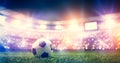 Football soccer ball on grass field on stadium Royalty Free Stock Photo