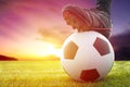 Football or soccer ball at the kickoff of a game with sunset Royalty Free Stock Photo