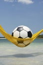 Football Soccer Ball Relaxing in Beach Hammock