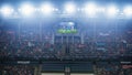 Football Soccer Championship Stadium Match, Scoreboard Screen Showing Repeat of the Goal. Crowd of