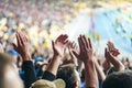 Football- soccer fans support their team and celebrate goal in full stadium with open air Royalty Free Stock Photo