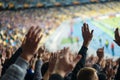 Football- soccer fans support their team and celebrate goal in full stadium with open air Royalty Free Stock Photo