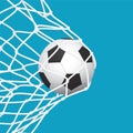 Football / Soccer Goal. Ball in Net on Blue Background. Royalty Free Stock Photo