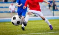 Football Soccer Kick. Boys Kicking Soccer Ball on the Pitch. Soccer football match Royalty Free Stock Photo