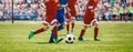 Football soccer match for children. Boys playing a football game in a school tournament. Picture of kids competition Royalty Free Stock Photo