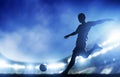 Football, soccer match. A player shooting on goal Royalty Free Stock Photo