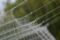 Football or soccer net background, view from behind the goal with blurred stadium and field pitch. Royalty Free Stock Photo