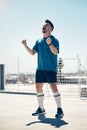 Football, soccer player and athlete man in celebration after winning or scoring a goal at sports match or game in the Royalty Free Stock Photo