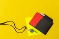 Football soccer referee equipment on yellow background. Top view, space for your text. Sport concept