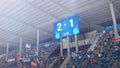 Football Soccer Stadium Championship Match, Scoreboard Screen Showing Score of 2:1. Crowd of Fans Royalty Free Stock Photo