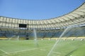 Football Soccer Stadium Sprinklers Spraying Grass Royalty Free Stock Photo