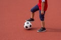 Football soccer training for kids. Boy running and kicking soccer ball. Young boy improving soccer skills Royalty Free Stock Photo