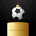 Football Sport Christmas bauble pedestal. Merry Christmas sport greeting card. Hang on a thread soccer, football ball as a xmas