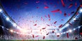 Football stadium background with flying confetti