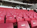 FootbAn empty rows of plastic seats in football stadium. Best observed from low angle Royalty Free Stock Photo