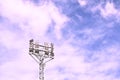 Football stadium lamp structure on blue sky background in sunny day
