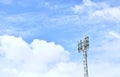 Football stadium lamp structure on blue sky background in sunny day