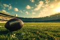 Football on sunny field with stadium in the background, ready for kickoff