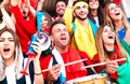 Football supporter fans cheering with drums watching soccer cup match at stadium bleachers Royalty Free Stock Photo