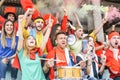 Football supporter fans watching international soccer match - Young group of excited friends having fun exulting at soccer world Royalty Free Stock Photo