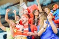 Football supporter fans watching world soccer match at stadium - Young group of excited friends having fun exulting Royalty Free Stock Photo