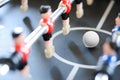 Football table game players suggesting team coaching Royalty Free Stock Photo