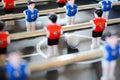 Football table game players suggesting team coaching Royalty Free Stock Photo