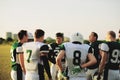 Football team talking together at practice Royalty Free Stock Photo